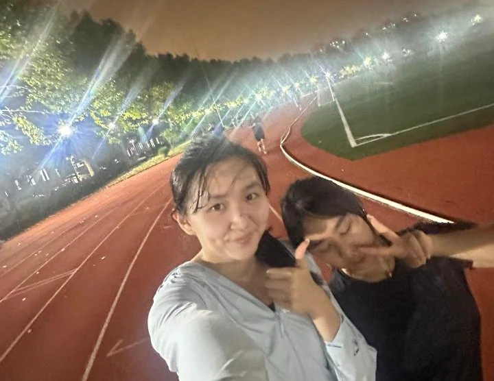 An evening on the campus running track in Shanghai. Friendships have helped Bellicia settle into a city far from home.